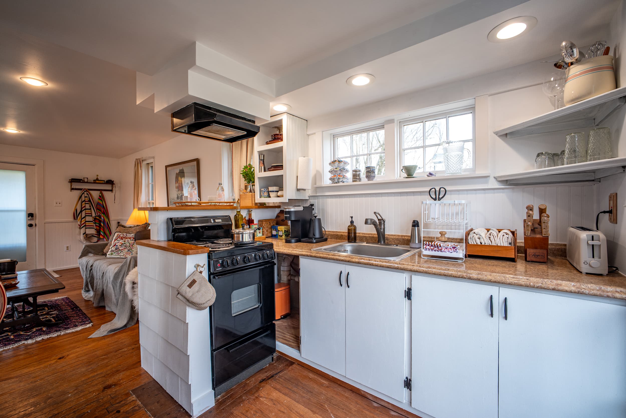 Full kitchen with open shelving and butcher block counters